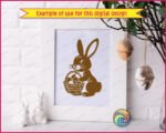 Silhouette of a bunny rabbit sitting bright-eyed and cheerful, holding a woven basket packed with charming Easter eggs. Soft whiskers, sweet paws, fluffy tail, and bold silhouette lines give this bunny-with-easter-eggs design a warm spring sparkle.