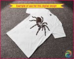 Silhouette image of a tarantula spider with a bold and striking design. The spider has thick, hairy legs that curve outward with lifelike texture, giving it a realistic and slightly intimidating presence. Its body is full and rounded, with distinct segmentation and intricate detail. The tarantula’s fangs are prominently visible, large and sharp, adding to the dramatic and fierce appearance.