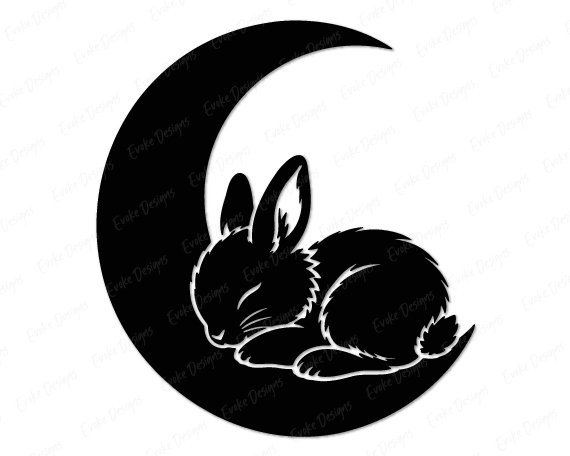 Sleeping Bunny in Moon Black silhouette image of a sleeping bunny curled up on a crescent moon. The sleepy baby rabbit is shown in profile, with long ears, a fluffy tail, and closed eyes as it rests peacefully. This nursery nap time bunny is solid black with clean white outline details tracing its fur and body shape. The design sits inside a wide, smooth crescent moon shape, creating a cozy night sky graphic.